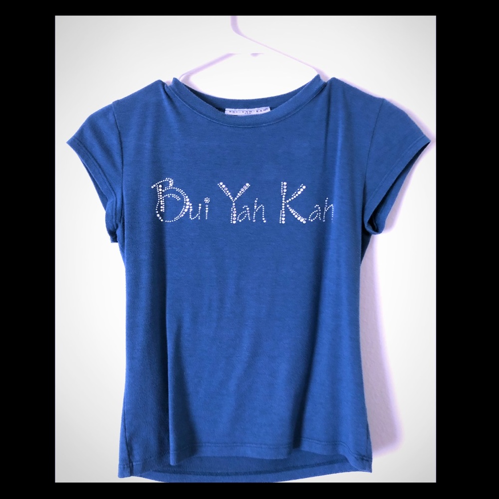 Bui Yah Kah crystal on teal shirt